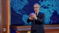 John Oliver Eats a Hot Dog and Throws a Football on Air as a Challenge ‘to Be an American for One Minute’